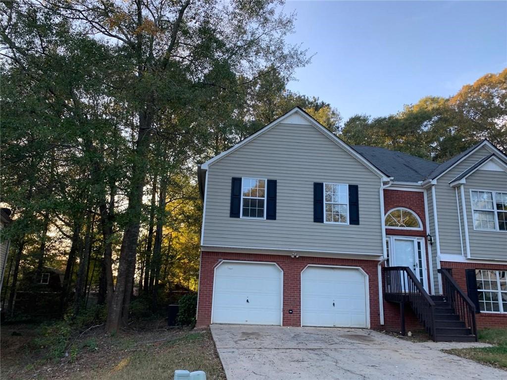 4055 Mistymorn Lane Powder Springs, GA 30127 - Photo 8 of 8 a front view of a house with a garage