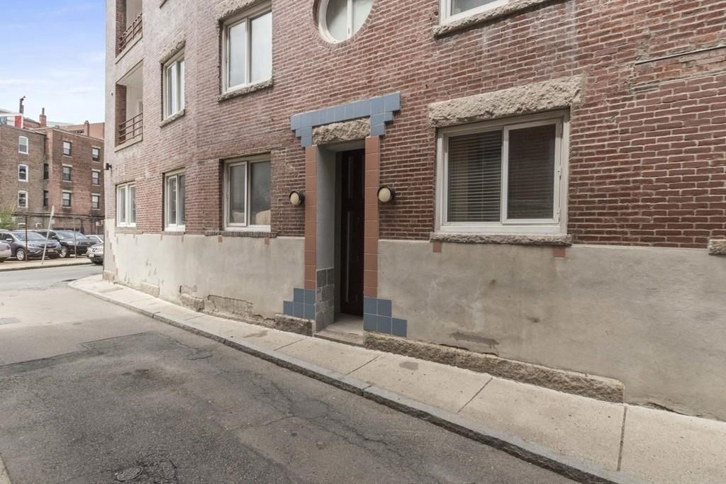 19 Wiget Street, Unit 302 Boston, MA 02113 - Photo 14 of 15 a view of a brick house with many windows