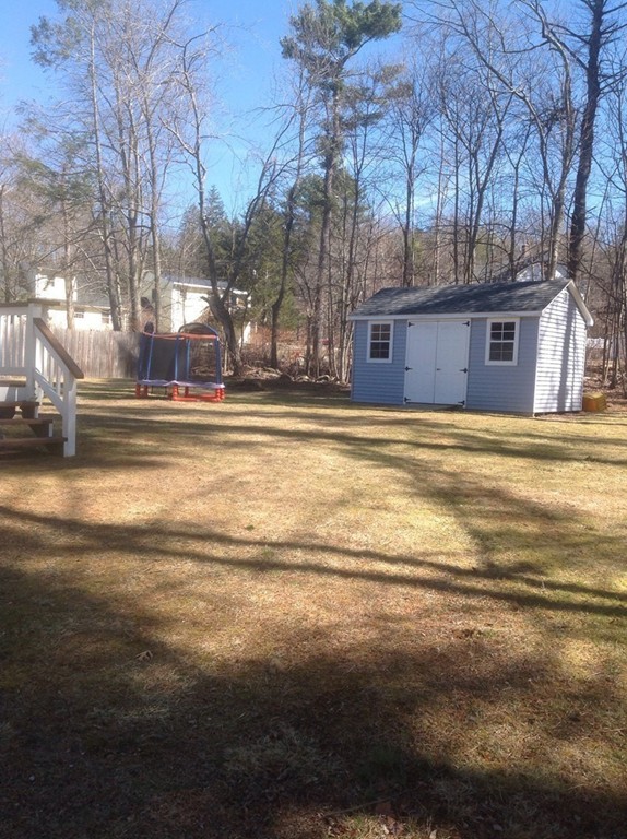 7 Farquhar Road Sturbridge, MA 01566 - Photo 17 of 18 a view of a house with a yard