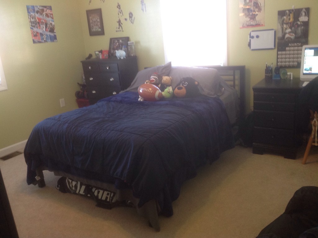 7 Farquhar Road Sturbridge, MA 01566 - Photo 9 of 18 a bed sitting in a bedroom next to a lamp