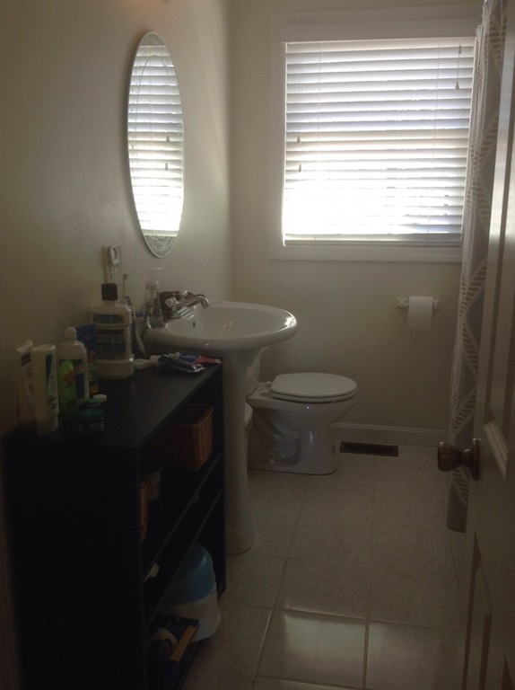 7 Farquhar Road Sturbridge, MA 01566 - Photo 10 of 18 a bathroom with a toilet sink and window