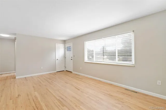 a kitchen with stainless steel appliances granite countertop a refrigerator stove and sink