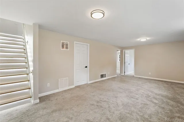 a balcony with table and chairs