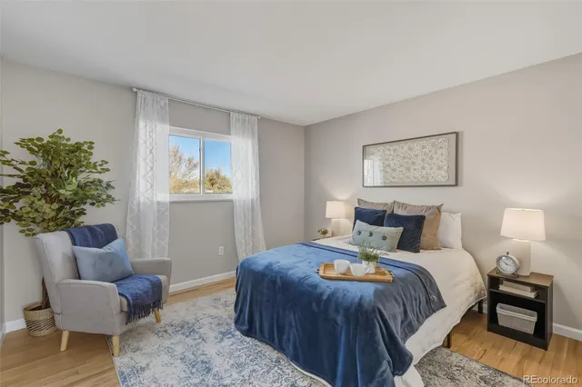 a bedroom with bed and a couch