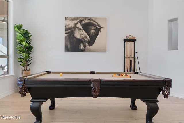 a kitchen with stainless steel appliances a sink stove and cabinets