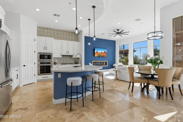 a kitchen with stainless steel appliances a sink and cabinets