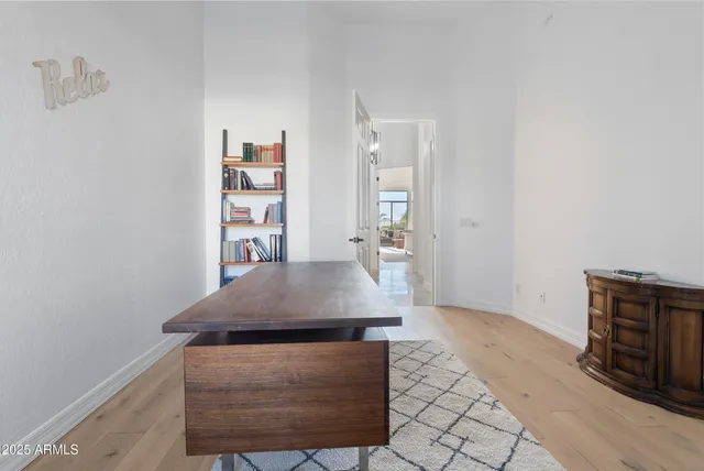 a spacious bathroom with a double vanity sink a mirror and a bathtub