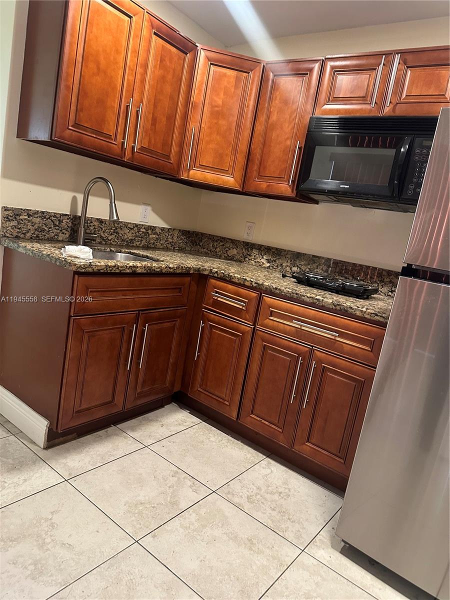 1360 Northeast 144th Street, Unit 3 Miami, FL 33161 - Photo 2 of 12 a close view of sink