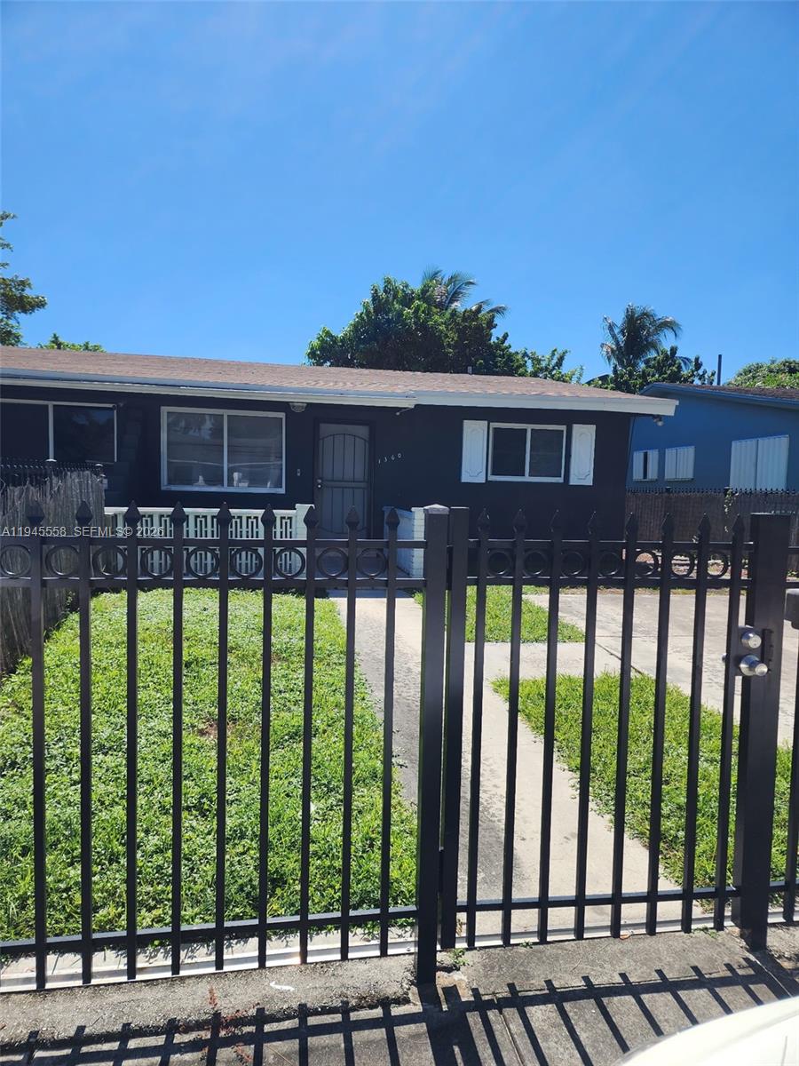 1360 Northeast 144th Street, Unit 3 Miami, FL 33161 - Photo 9 of 12 a view of house with a yard