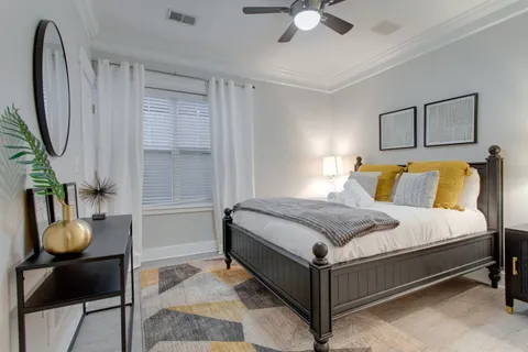 a bedroom with a bed and window