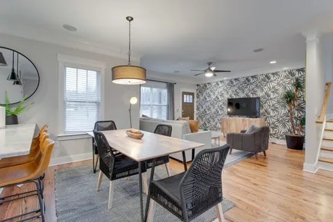 a view of a dining room with furniture window and wooden floor