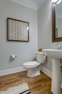 a bathroom with a toilet and a sink