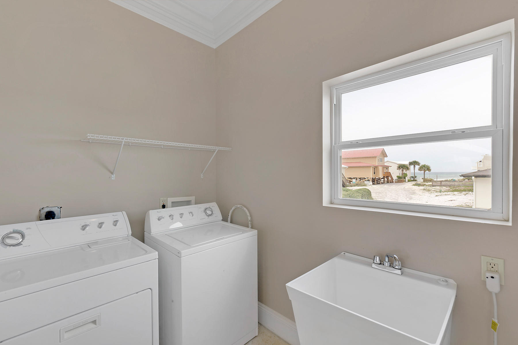 42 Fort Panic Road Santa Rosa Beach, FL 32459 - Photo 34 of 60 a view of bathroom with a washer and dryer