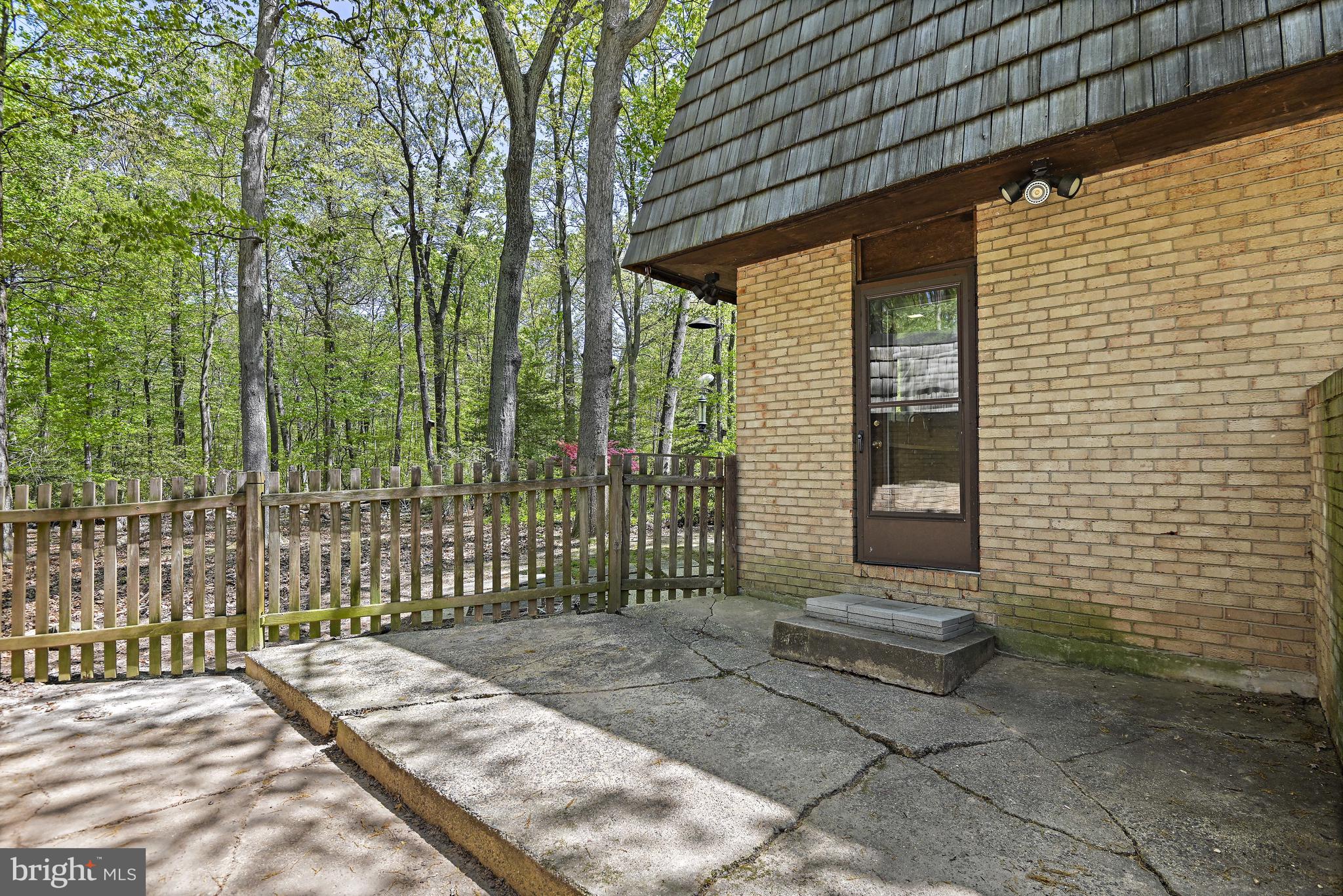 12008 Whip Road Reston, VA 20191 - Photo 42 of 48 The kitchen door leads to the side patio & garage.