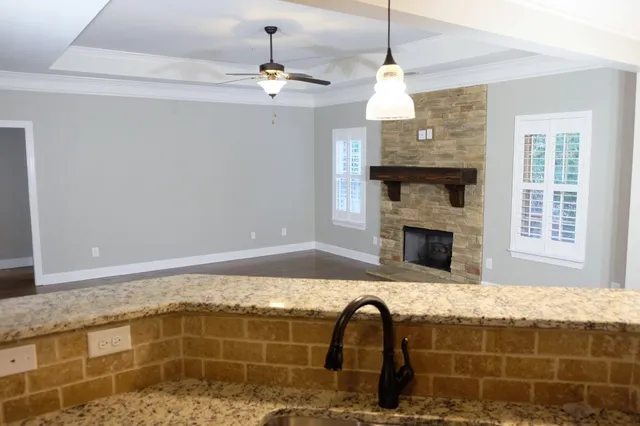 a bedroom with a bed and a fireplace