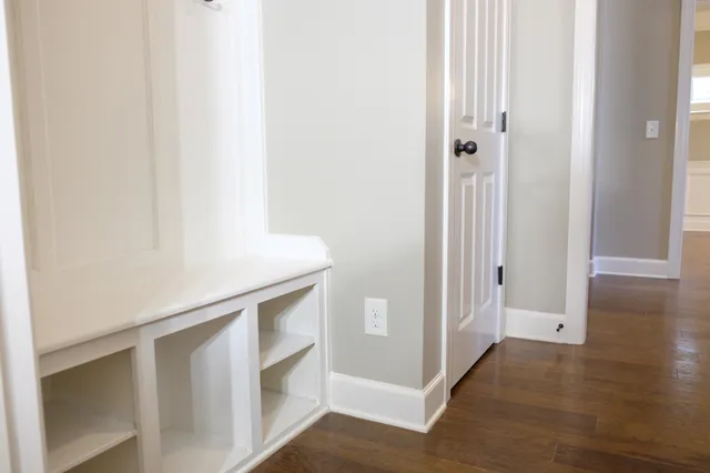 a view of an entryway with wooden floor