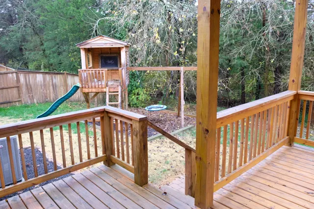 a view of a balcony with wooden floor