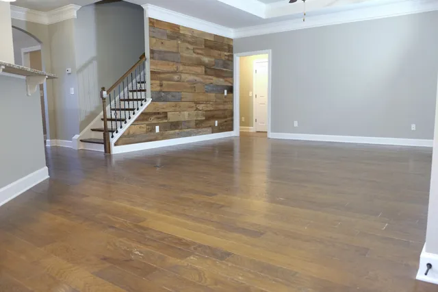 a view of an entryway with wooden floor