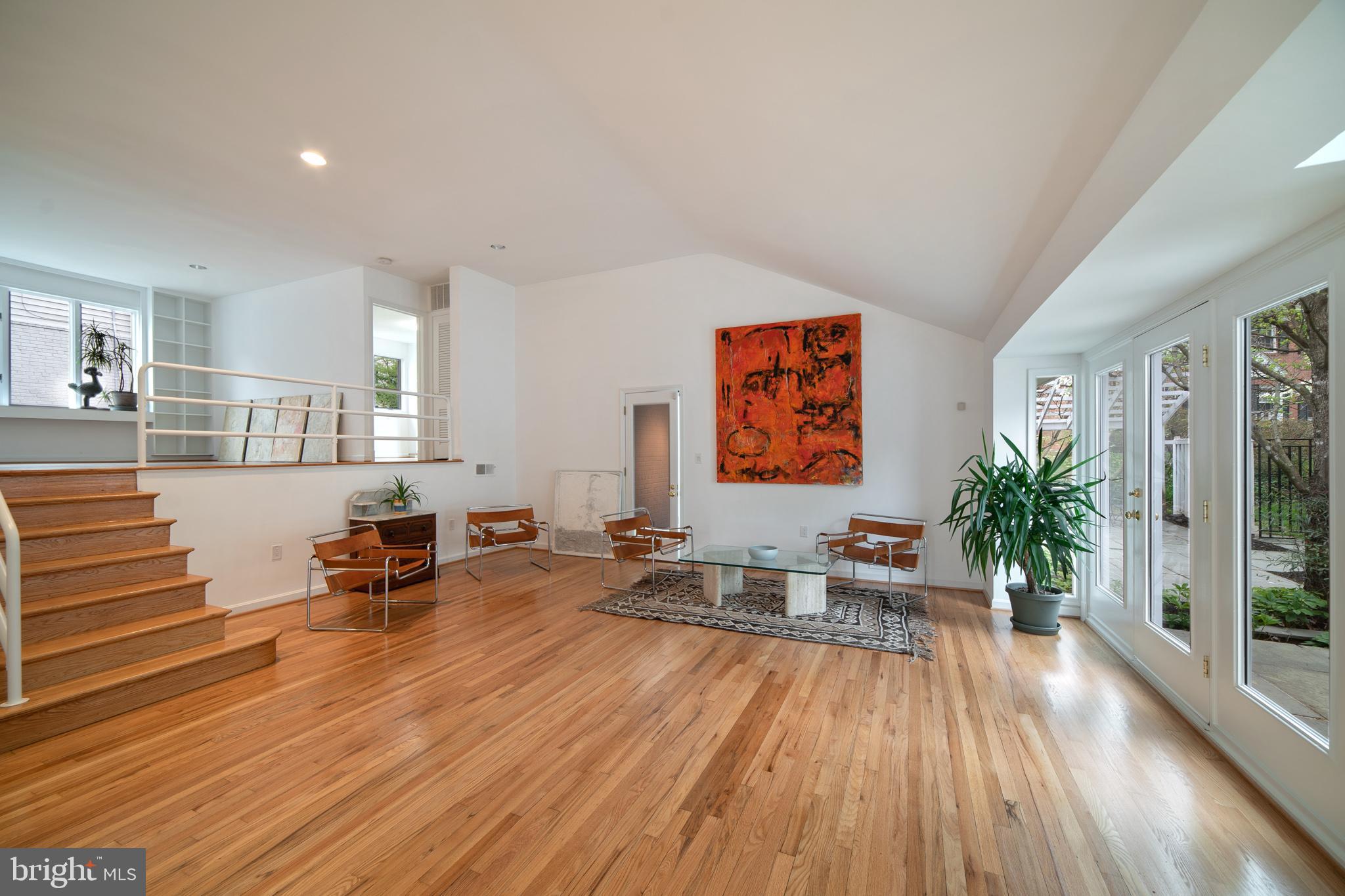 4929 Jamestown Road Bethesda, MD 20816 - Photo 11 of 39 Light-filled living room with vaulted ceiling