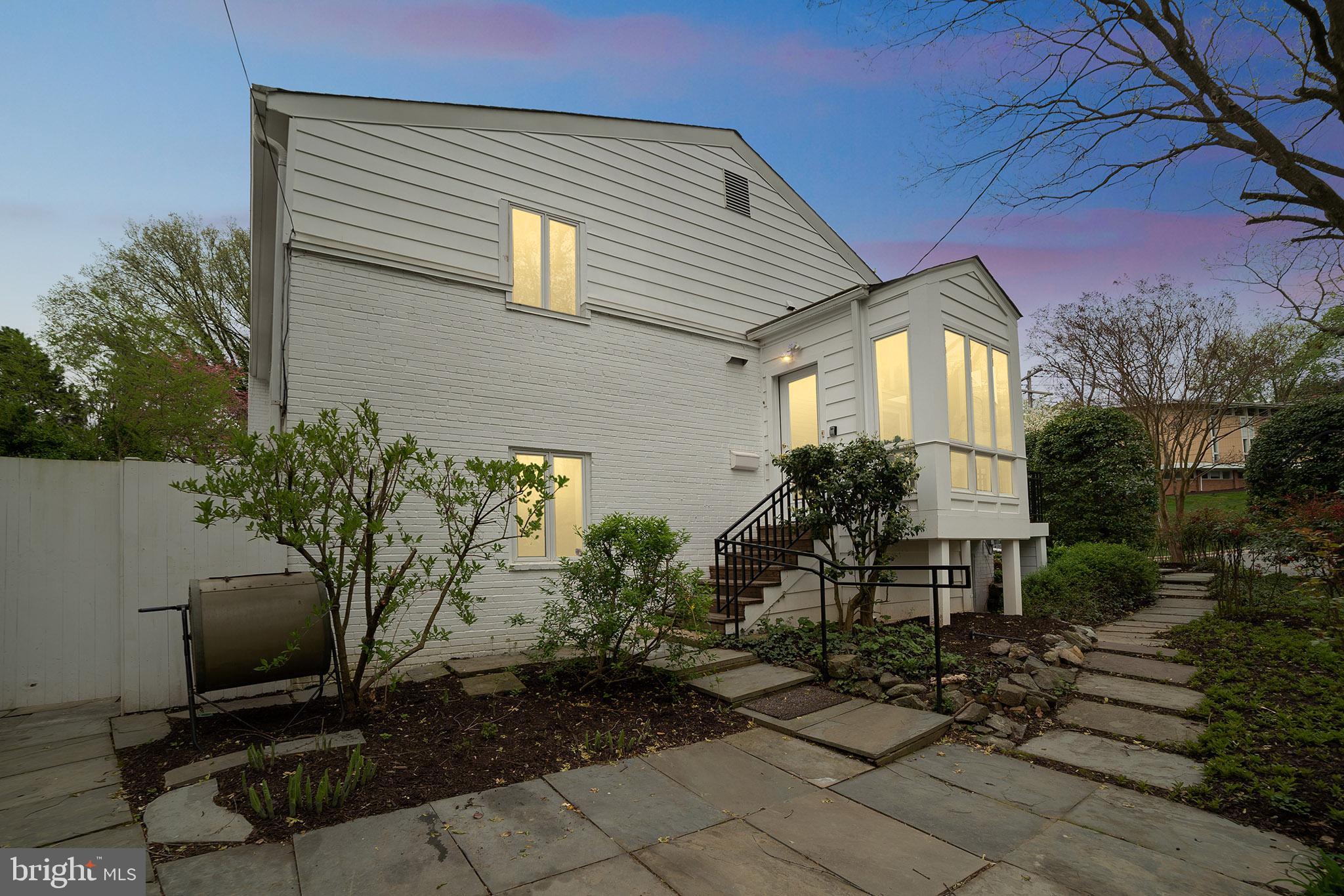 4929 Jamestown Road Bethesda, MD 20816 - Photo 7 of 39 Side yard at dusk