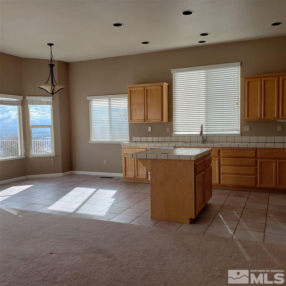 986 University Place Reno, NV 89512 - Photo 13 of 25 a kitchen with a sink window and cabinets