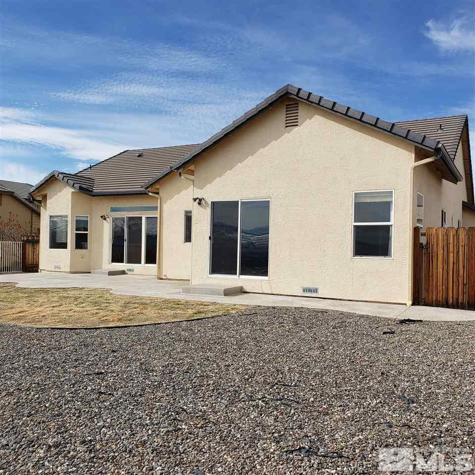 986 University Place Reno, NV 89512 - Photo 6 of 25 a front view of a house with a yard