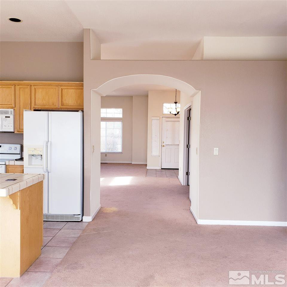 986 University Place Reno, NV 89512 - Photo 7 of 25 a view of a kitchen with a refrigerator a sink and a dishwasher