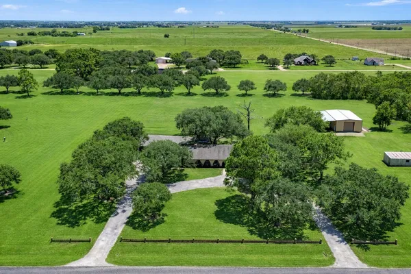 a view of a big yard with lots of green space and mountain view
