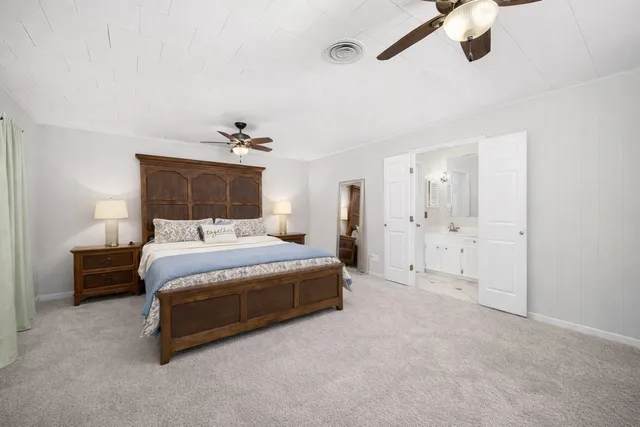 a bedroom with a bed and closet