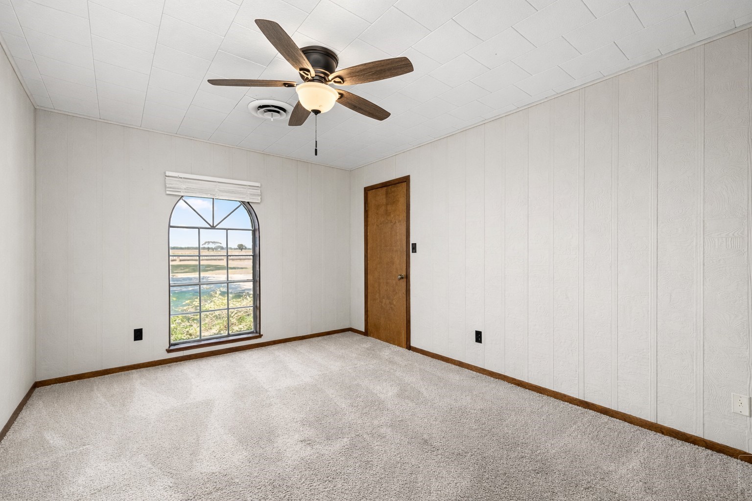 3148 FM 333 Road Garwood, TX 77442 - Photo 21 of 39 an empty room with windows and fan