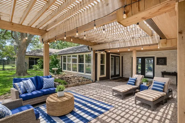 a outdoor living space with patio furniture and garden view