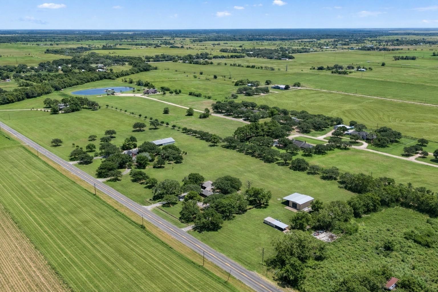 3148 FM 333 Road Garwood, TX 77442 - Photo 32 of 39 a view of a lush green field
