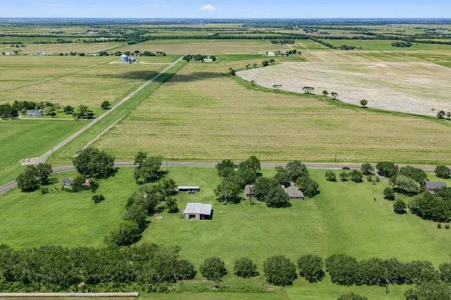 a view of a lake with houses in the back