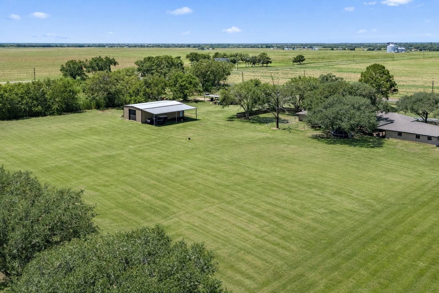 3148 FM 333 Road Garwood, TX 77442 - Photo 35 of 39 a view of a lake with houses in the back