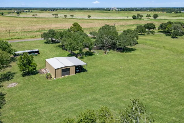 a backyard of a house with lots of green space and fog