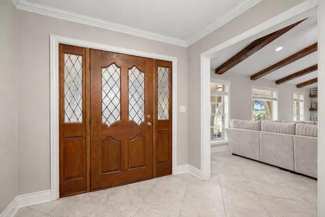 a view of a room with furniture and window
