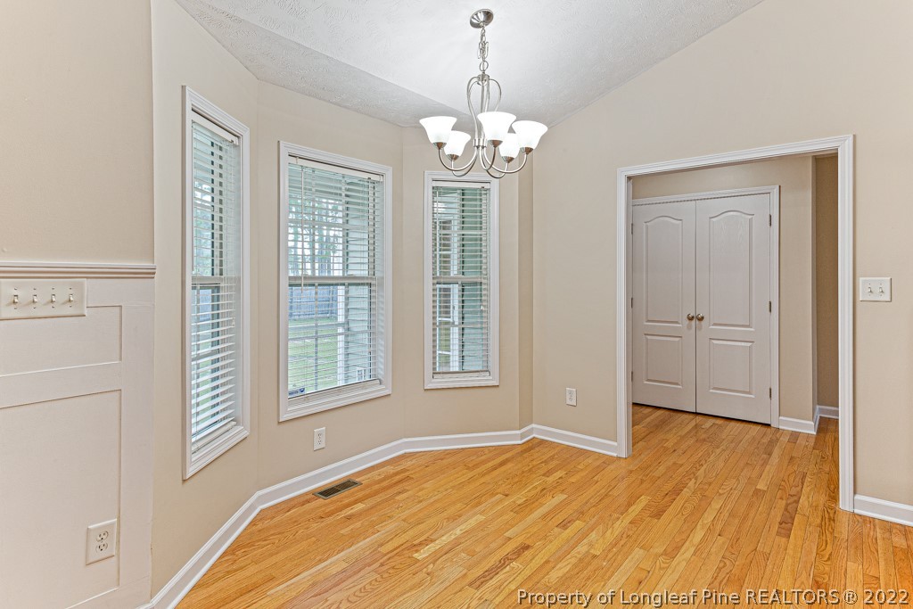 75 Hayden Lane Cameron, NC 28326 - Photo 12 of 35 a view of an empty room with wooden floor and a window