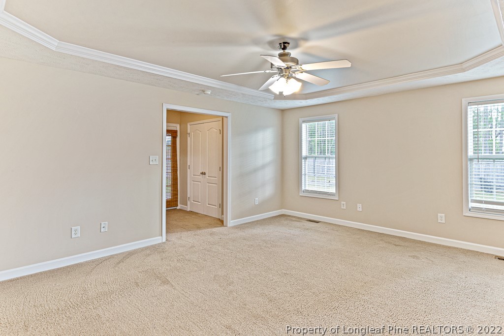 75 Hayden Lane Cameron, NC 28326 - Photo 15 of 35 an empty room with windows and fan