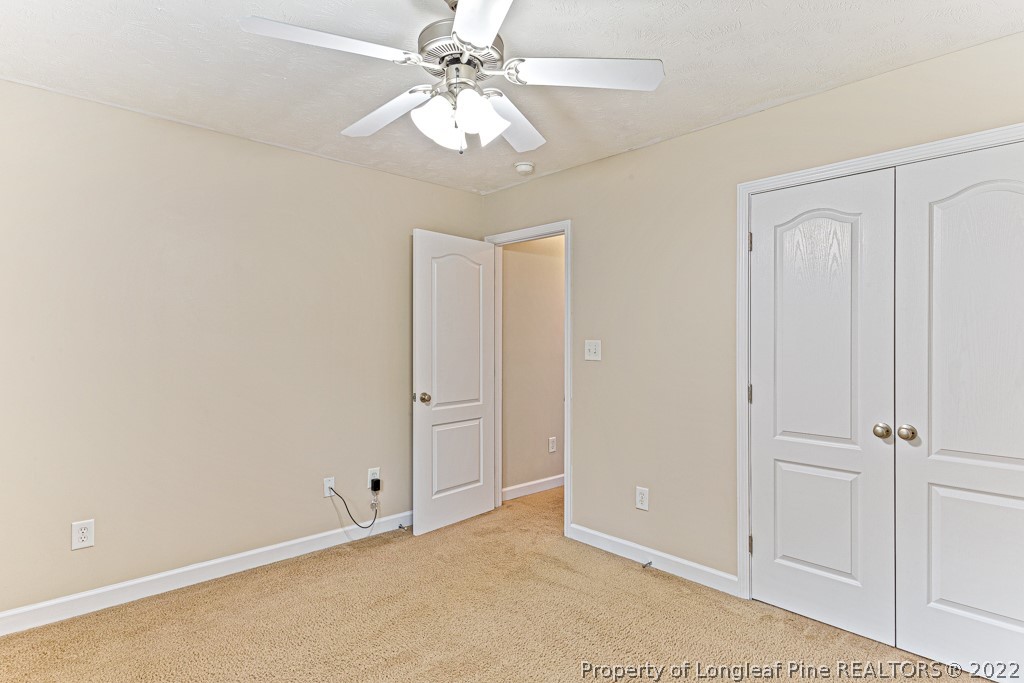 75 Hayden Lane Cameron, NC 28326 - Photo 20 of 35 an empty room with a ceiling fan