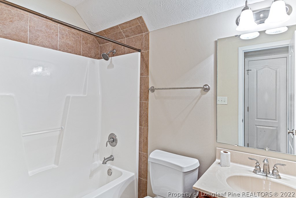 75 Hayden Lane Cameron, NC 28326 - Photo 28 of 35 a bathroom with a sink a toilet and shower