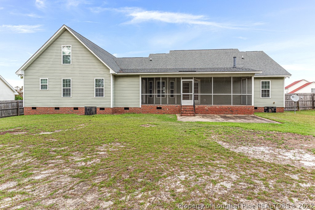 75 Hayden Lane Cameron, NC 28326 - Photo 30 of 35 a front view of a house with a yard and trees