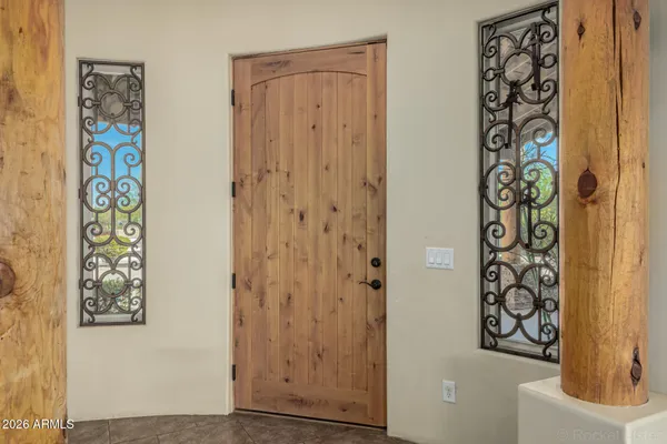 a view of a room with a ceiling fan and a window