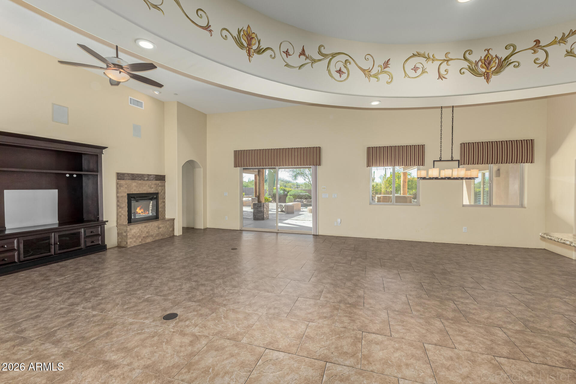 6033 East Lone Mountain Road Cave Creek, AZ 85331 - Photo 15 of 77 a view of an empty room and a fireplace