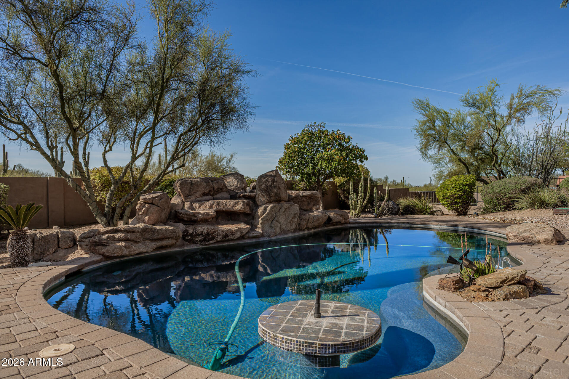 6033 East Lone Mountain Road Cave Creek, AZ 85331 - Photo 2 of 77 a view of a house with backyard and sitting area