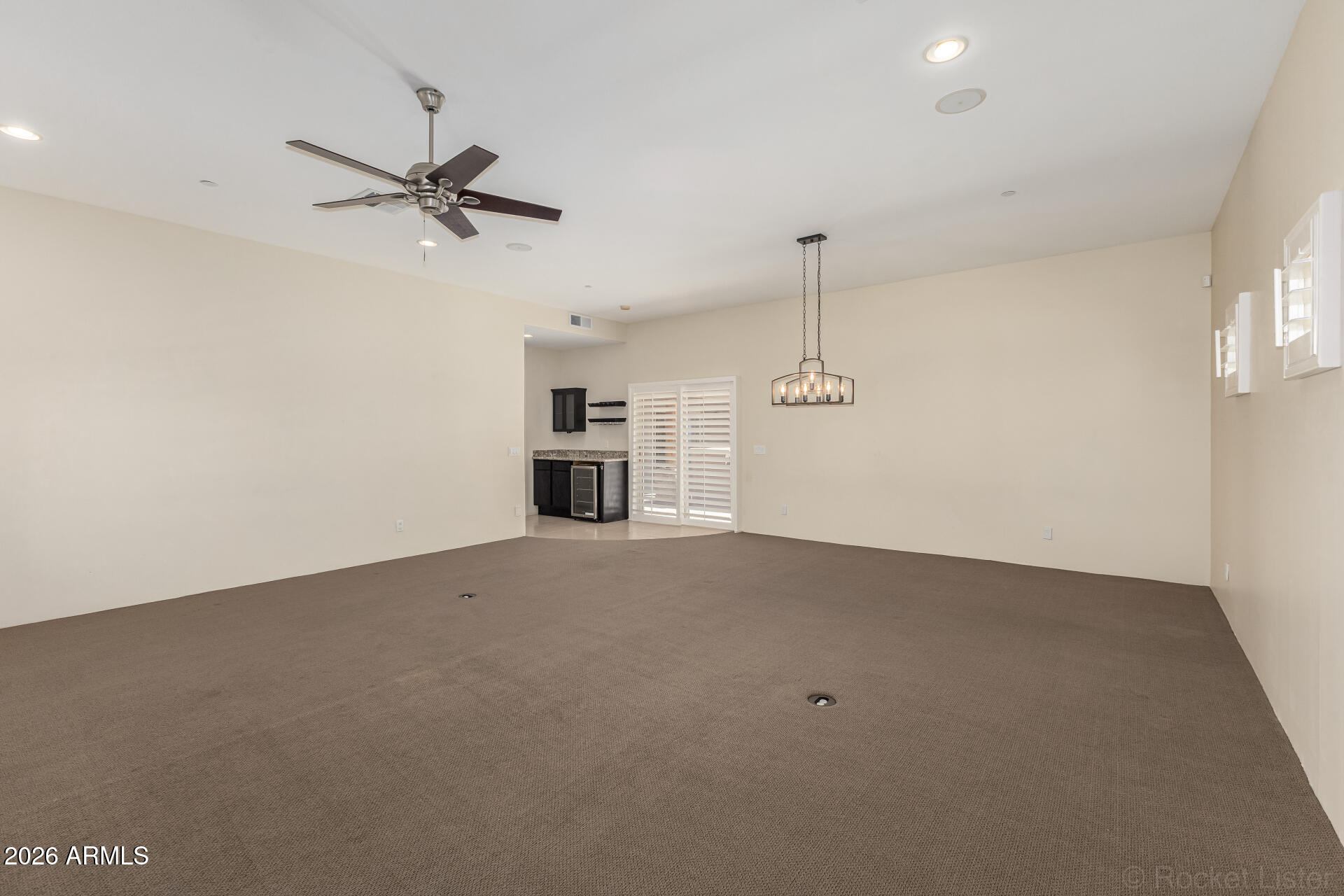 6033 East Lone Mountain Road Cave Creek, AZ 85331 - Photo 34 of 77 a view of a room with a ceiling fan and a window