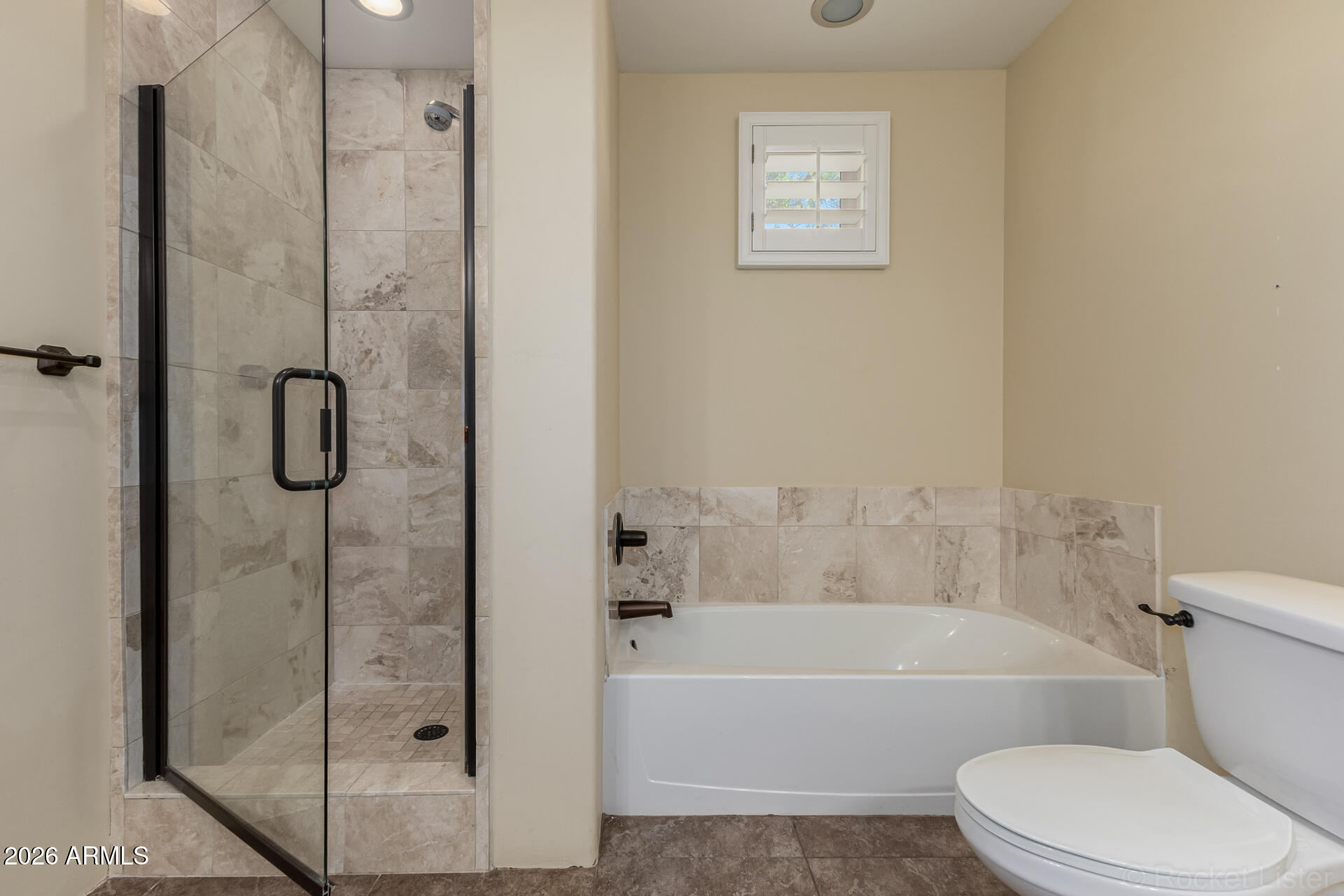 6033 East Lone Mountain Road Cave Creek, AZ 85331 - Photo 40 of 77 a bathroom with a toilet and a shower