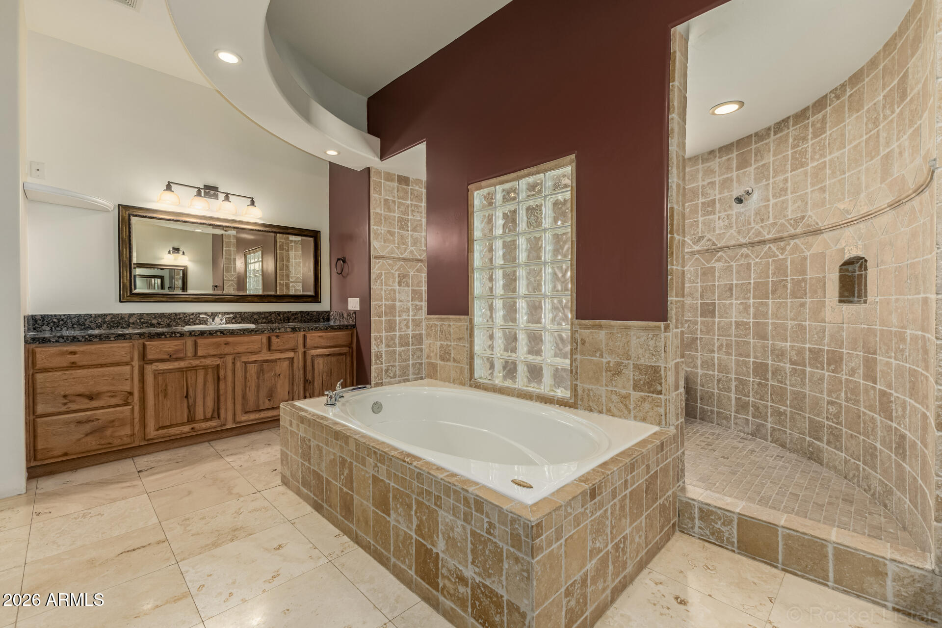 6033 East Lone Mountain Road Cave Creek, AZ 85331 - Photo 7 of 77 a bathroom with a tub a sink a mirror and a bathtub