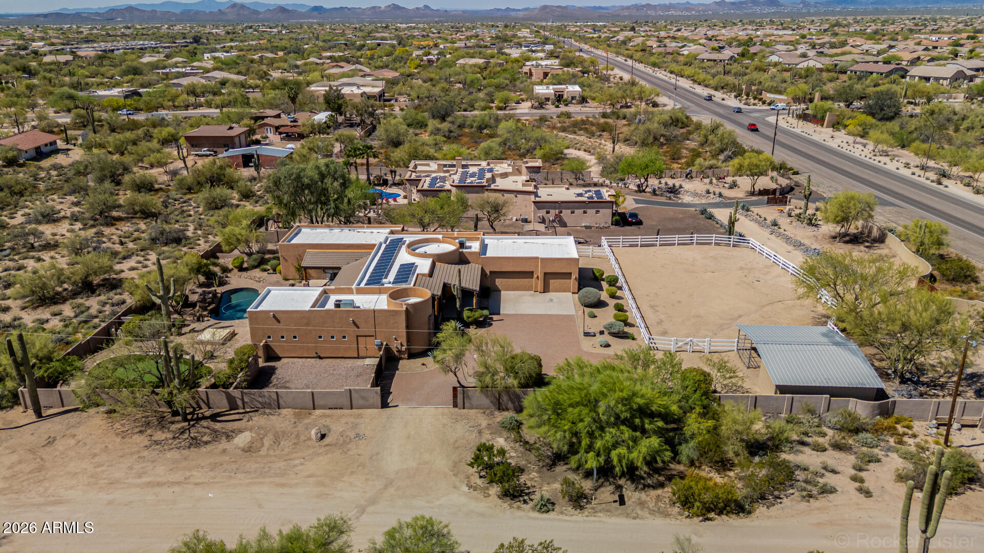 6033 East Lone Mountain Road Cave Creek, AZ 85331 - Photo 77 of 77 an aerial view of a city with lots of residential buildings