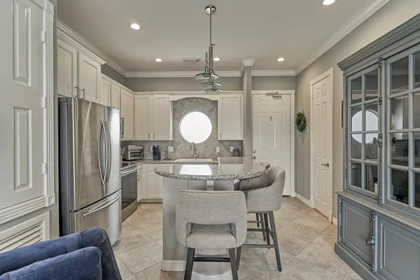 a view of roof deck with seating space and barbeque oven