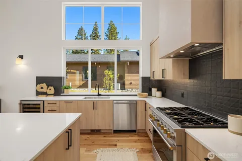 a kitchen with a stove and a sink